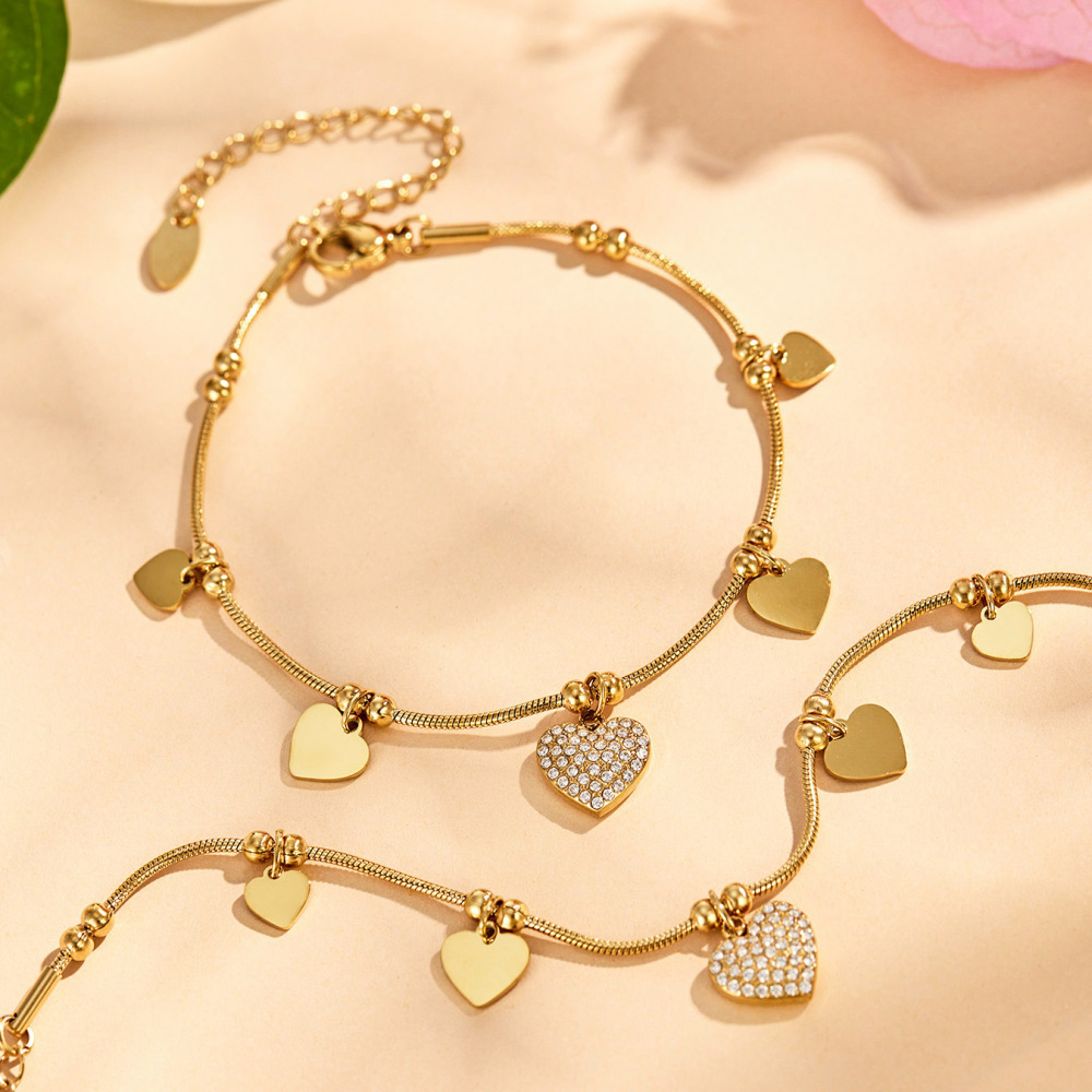 Bracelet À Breloques Pour Femme, Élégant, En Acier Inoxydable, Couleur Or, Orné D'Une Fleur Et D'Un Cœur. Collection Luxueuse. Image3