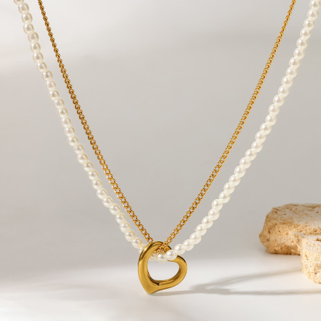 Collier pendentif élégant en forme de cœur, en acier inoxydable étanche, couleur or, avec perle artificielle.