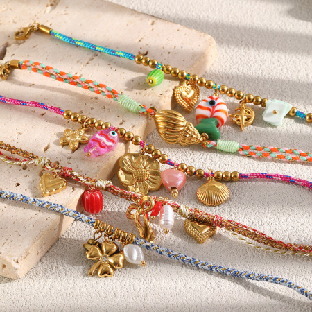 Bracelet tressé pour femme, collection Romantique, nœud papillon fleuri, trèfle, en acier inoxydable, étanche, couleur or.