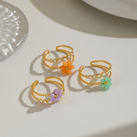 Bagues en acier inoxydable étanches Sweet Flower avec zircon doré