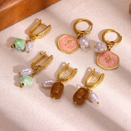 Boucles d'oreilles pendantes pour femme, élégantes et irrégulières, en forme de croix, en acier inoxydable, couleur or, de la collection Romantic.