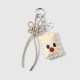 Un porte-clés en forme de biscuit beige Image3