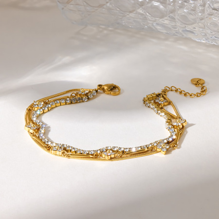 Bracelet chaîne femme romantique et élégant en acier inoxydable doré, forme irrégulière, orné de fleurs élégantes et romantiques.
