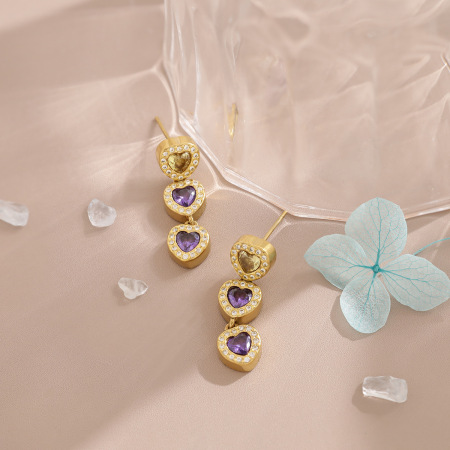 Boucles d'oreilles pendantes pour femme, en acier inoxydable doré, ornées de strass et de zircon, avec un cœur de luxe. Collection Luxe.