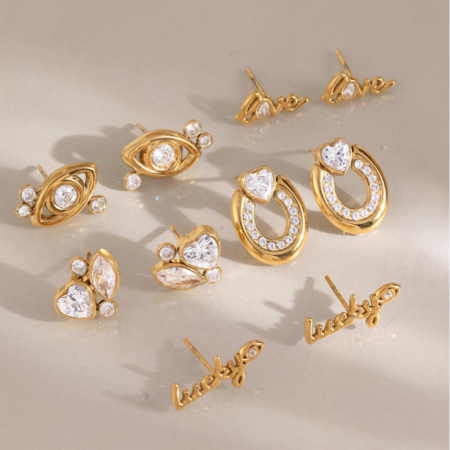 Boucles d'oreilles puces luxueuses pour femme, en acier inoxydable doré, ornées d'un zircon et d'un motif œil du diable de forme irrégulière.