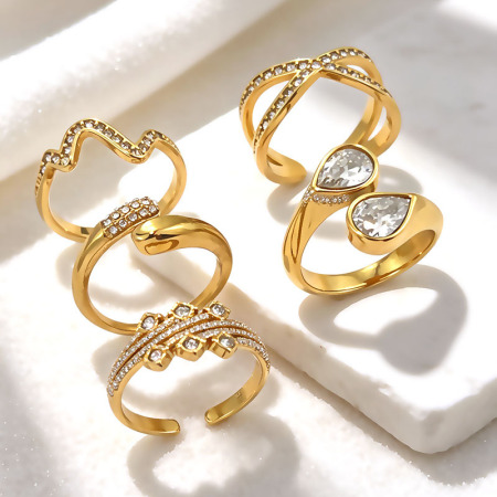 Bagues pour femmes en acier inoxydable de forme simple et irrégulière, couleur or, imperméables, ornées de strass et de zircon.