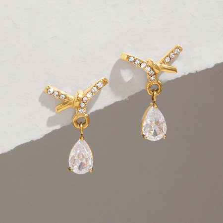 Boucles d'oreilles pendantes pour femme en acier inoxydable doré, imperméables, avec nœud papillon, strass et zircon.