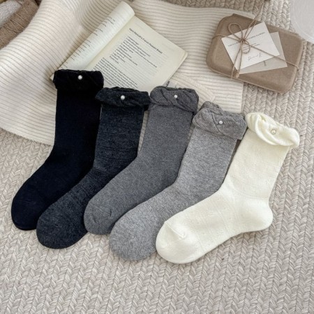 Chaussettes mi-mollet élégantes et confortables pour femmes, couleur unie.